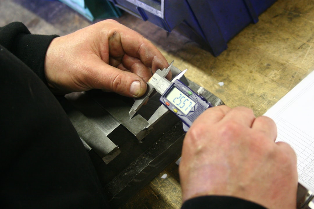 Quality control inspector measuring furniture components with precision caliper